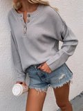 buttoned exposed seam high low sweater