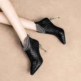 peacock pattern embossed leather ankle boot